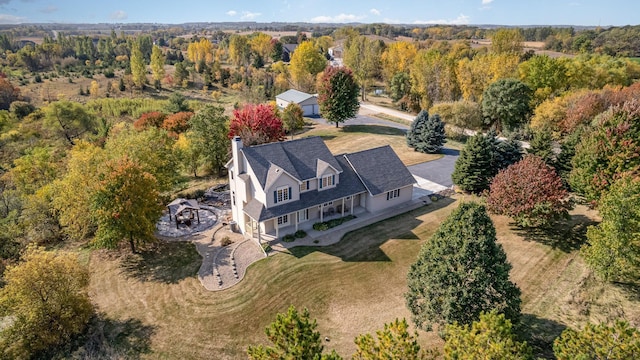 aerial view featuring a view of trees