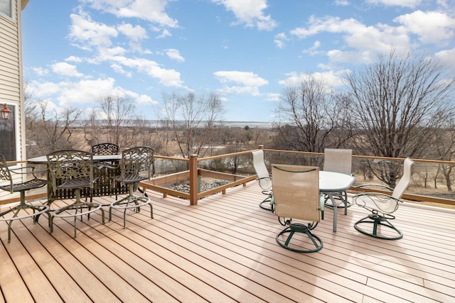 wooden terrace featuring outdoor dining area