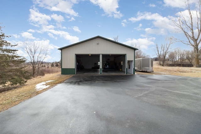 exterior space with a garage and an outdoor structure