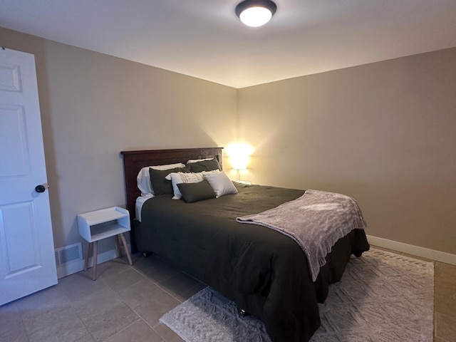 bedroom featuring visible vents and baseboards