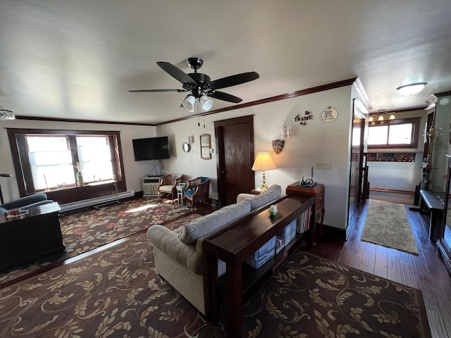 living room with baseboards, baseboard heating, wood finished floors, and crown molding