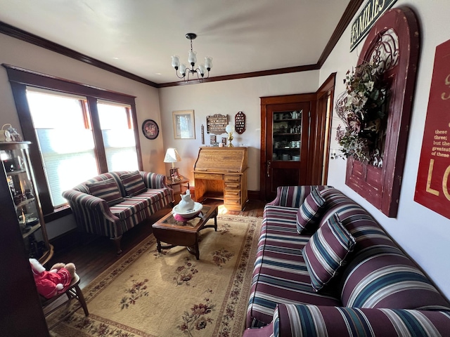 living room with ornamental molding, wood finished floors, and an inviting chandelier