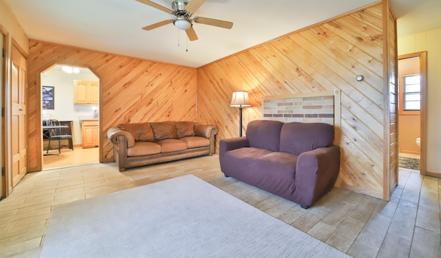61279 US Highway 169, Hill City, MN 55748 - living area with light wood-type flooring, wooden walls, and a ceiling fan