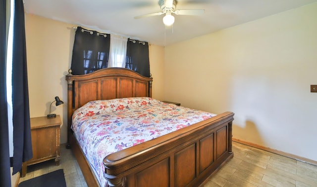 61279 US Highway 169, Hill City, MN 55748 - bedroom featuring baseboards, ceiling fan, and light wood-style floors