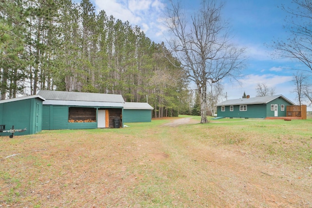 61279 US Highway 169, Hill City, MN 55748 - view of yard featuring a pole building, an outbuilding, and driveway