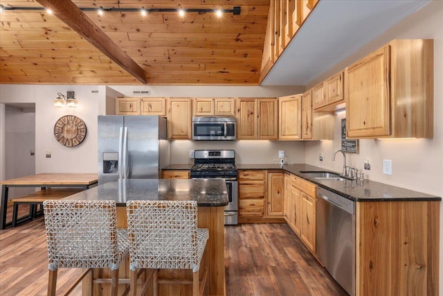 kitchen featuring stainless steel appliances, wooden ceiling, light brown cabinets, and a sink