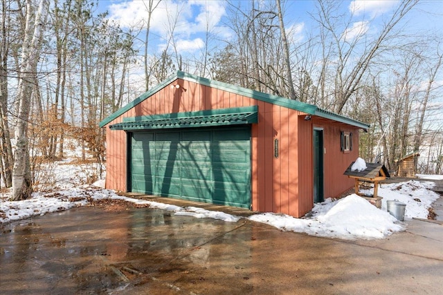 snow covered structure with an outdoor structure