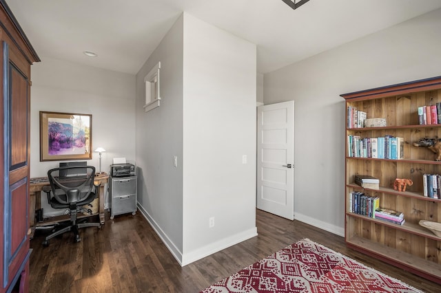 home office featuring baseboards and dark wood finished floors