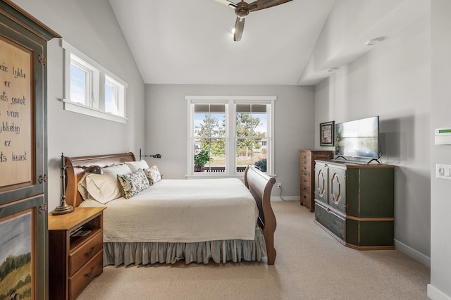 bedroom featuring light colored carpet, lofted ceiling, multiple windows, and baseboards