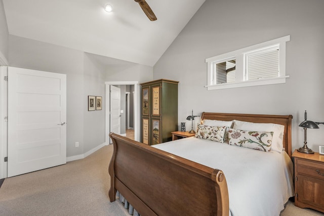 bedroom featuring light colored carpet, vaulted ceiling, baseboards, and ceiling fan