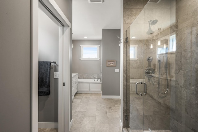 bathroom with visible vents, a shower stall, baseboards, and vanity