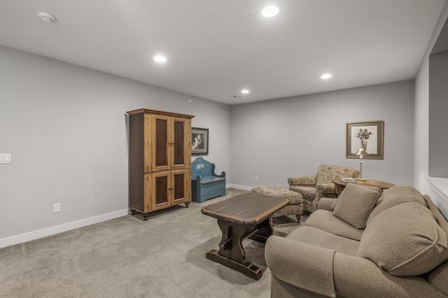 living area with light carpet, baseboards, and recessed lighting