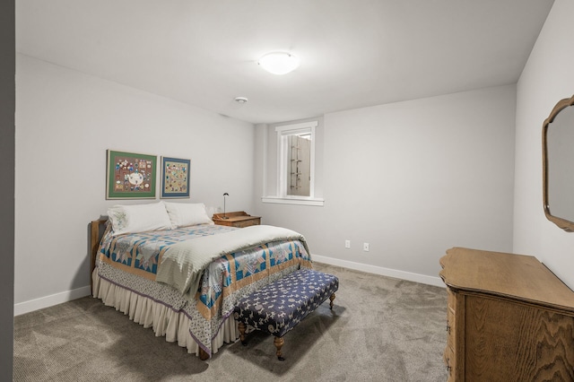 carpeted bedroom featuring baseboards