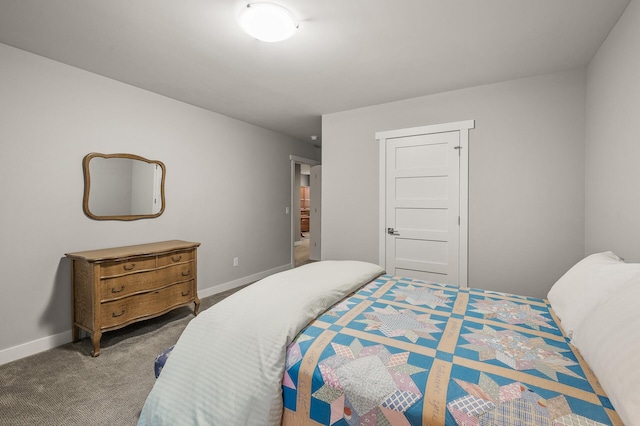 carpeted bedroom featuring baseboards