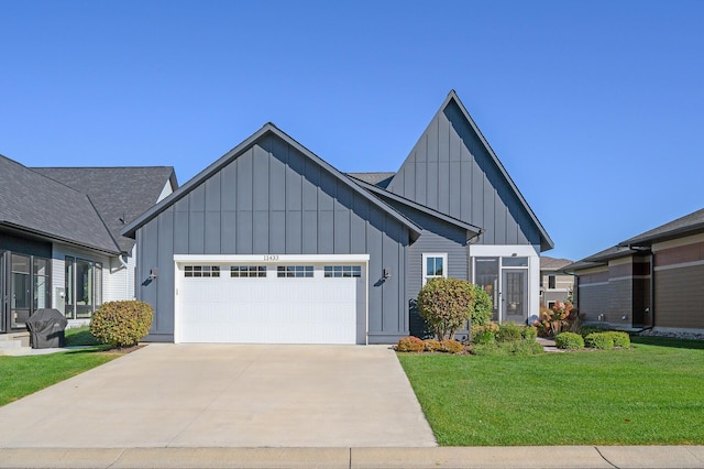 modern inspired farmhouse featuring a garage, concrete driveway, board and batten siding, and a front yard