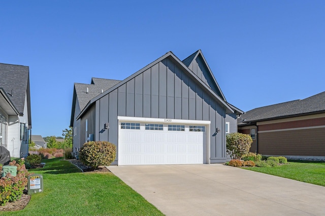 view of front of house featuring a garage, a shingled roof, concrete driveway, board and batten siding, and a front yard