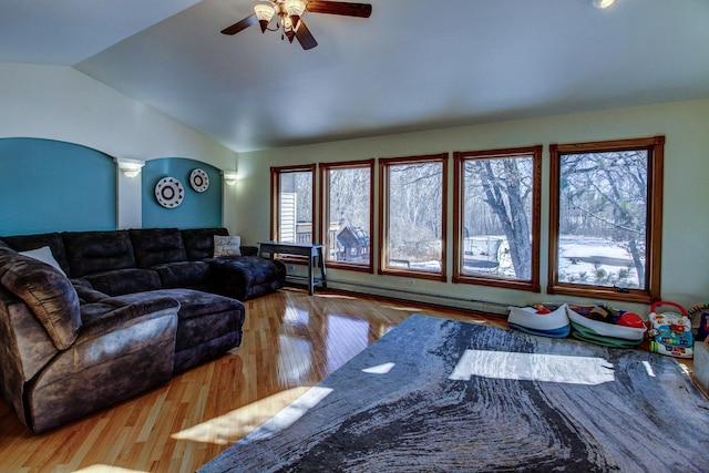 living area with a baseboard radiator, ceiling fan, lofted ceiling, and hardwood / wood-style flooring