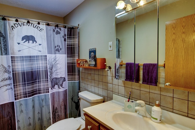 full bathroom featuring toilet, a shower with curtain, tile walls, and vanity