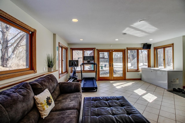 living room with recessed lighting, french doors, baseboards, and light tile patterned floors