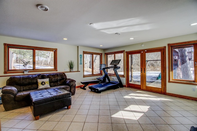 workout room with french doors, light tile patterned flooring, recessed lighting, and baseboards