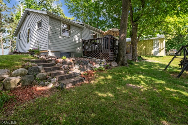 exterior space featuring a yard and a deck