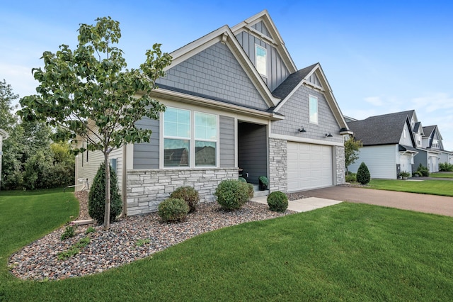 craftsman-style house featuring a garage, concrete driveway, stone siding, board and batten siding, and a front yard