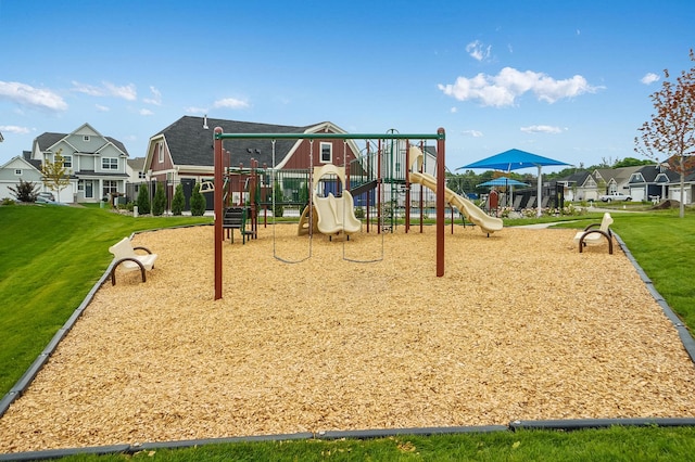 community play area with a residential view and a yard