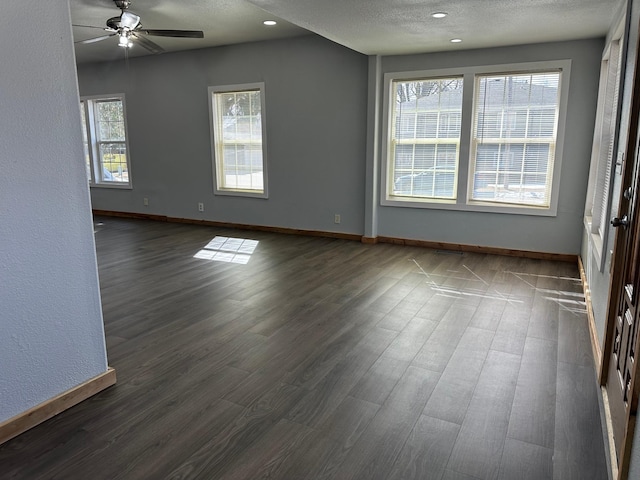 spare room with a textured ceiling, dark wood-style floors, recessed lighting, baseboards, and ceiling fan