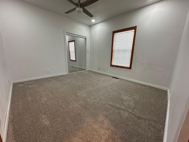 carpeted spare room featuring recessed lighting, a healthy amount of sunlight, and baseboards