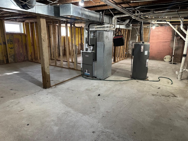 basement with heating unit and water heater