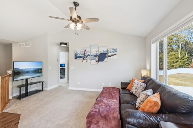 carpeted living area featuring a ceiling fan, lofted ceiling, visible vents, and baseboards