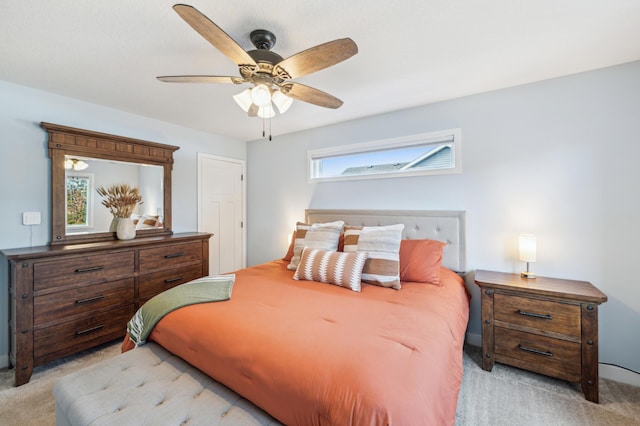 bedroom with light carpet and ceiling fan