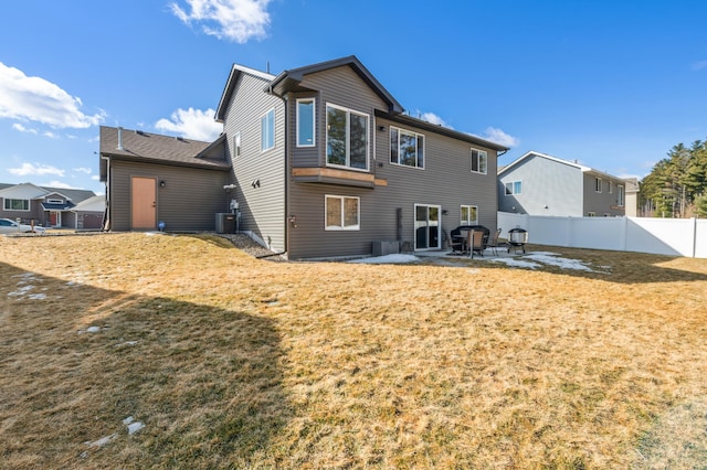 back of property featuring a patio, a yard, fence, and central air condition unit