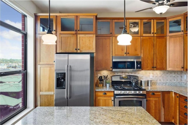 270 4th St E Unit 401, Saint Paul, MN 55101 - kitchen with stainless steel appliances, plenty of natural light, and brown cabinets