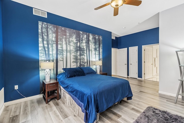 270 4th St E Unit 401, Saint Paul, MN 55101 - bedroom featuring wood finished floors, baseboards, and a ceiling fan