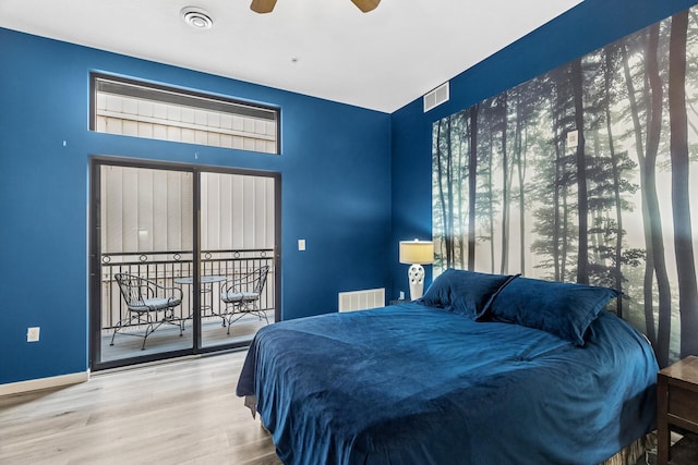 270 4th St E Unit 401, Saint Paul, MN 55101 - bedroom featuring wood finished floors, baseboards, access to outside, and ceiling fan
