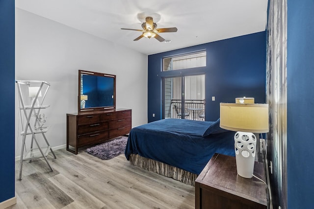 270 4th St E Unit 401, Saint Paul, MN 55101 - bedroom with wood finished floors, baseboards, and a ceiling fan
