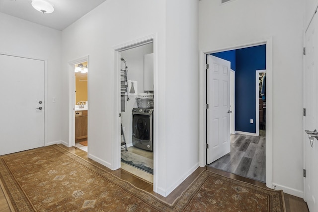 270 4th St E Unit 401, Saint Paul, MN 55101 - hallway with washer / dryer, wood finished floors, and baseboards
