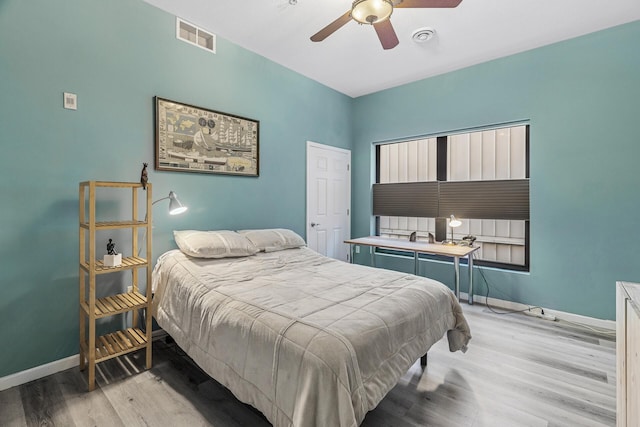 270 4th St E Unit 401, Saint Paul, MN 55101 - bedroom featuring baseboards, wood finished floors, and a ceiling fan