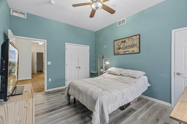 270 4th St E Unit 401, Saint Paul, MN 55101 - bedroom with light wood-type flooring, baseboards, a closet, and ceiling fan