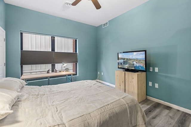 270 4th St E Unit 401, Saint Paul, MN 55101 - bedroom featuring wood finished floors, baseboards, and a ceiling fan