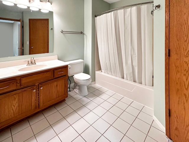 bathroom featuring shower / bath combo, baseboards, toilet, tile patterned flooring, and vanity