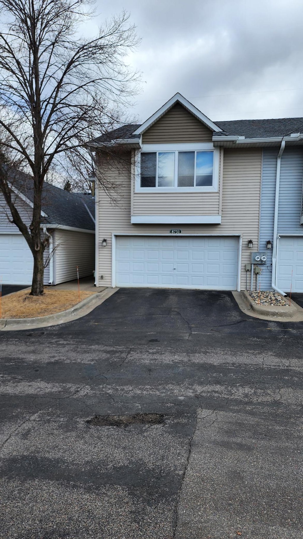 exterior space featuring an attached garage and driveway