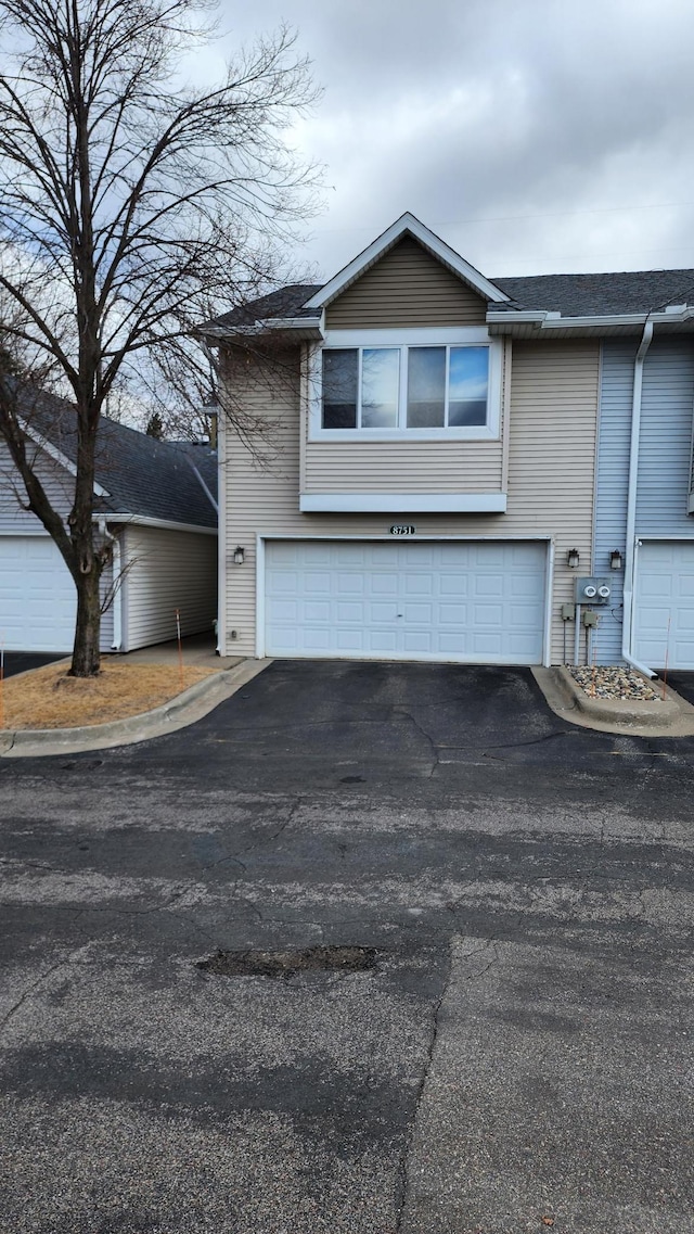 exterior space featuring an attached garage and driveway