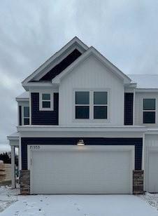 view of front of home featuring a garage and concrete driveway