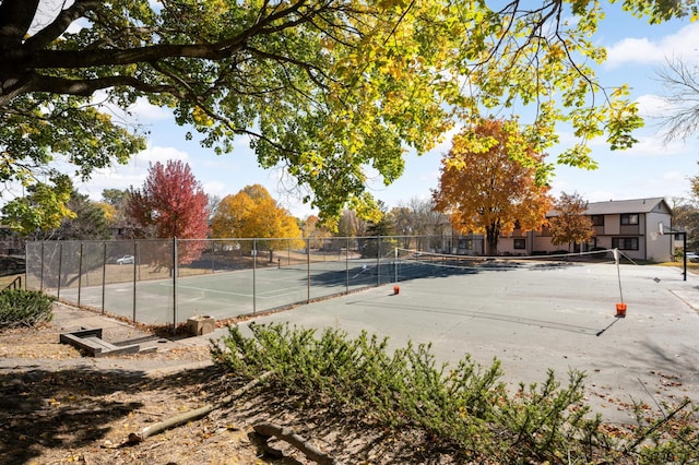 view of tennis court with fence