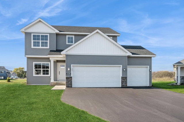 view of front of property with driveway, a shingled roof, an attached garage, board and batten siding, and a front yard