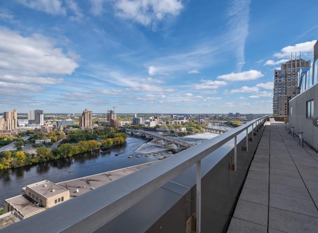 balcony with a view of city and a water view