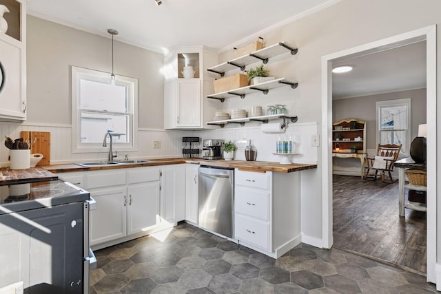 kitchen with a sink, crown molding, dishwasher, wood counters, and open shelves