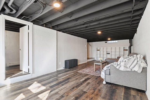 living room featuring wood finished floors, radiator heating unit, and a baseboard radiator